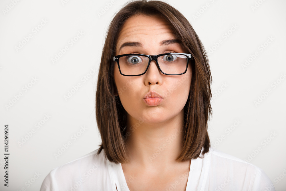 Portrait of girl playing ape over white background. Portrait of girl playing ape over white background.