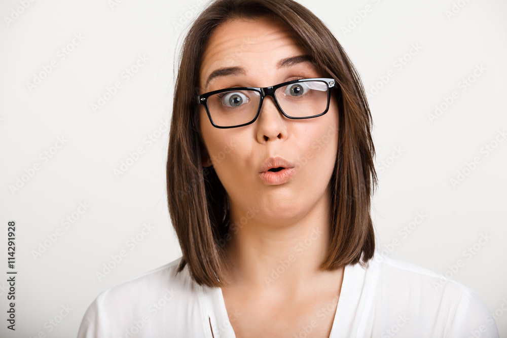 Portrait of girl playing ape over white background. Portrait of girl playing ape over white background.