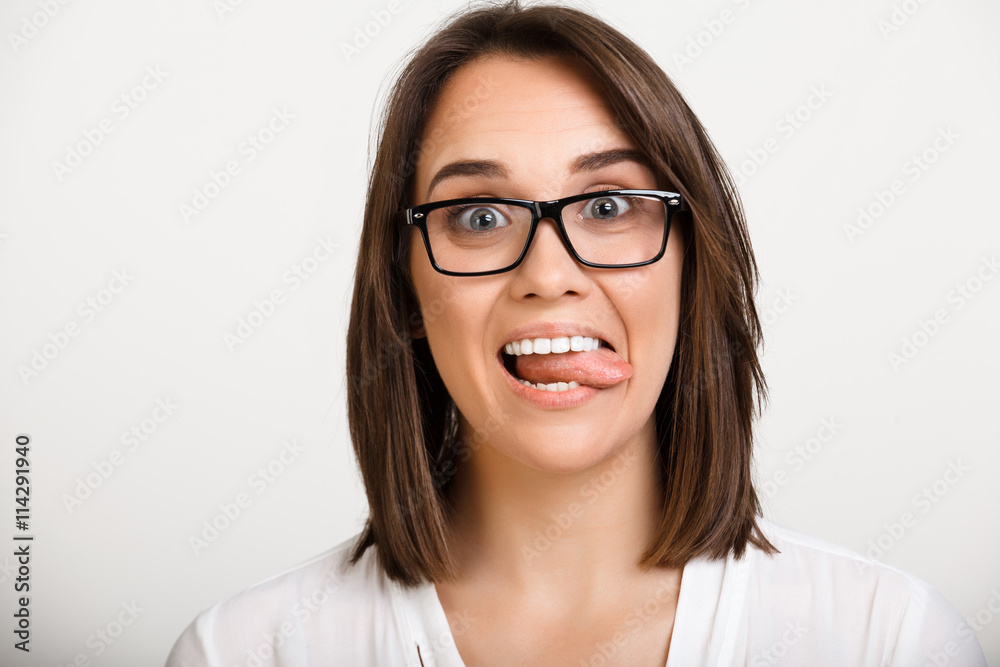 Portrait of girl playing ape over white background. Portrait of girl playing ape over white background.