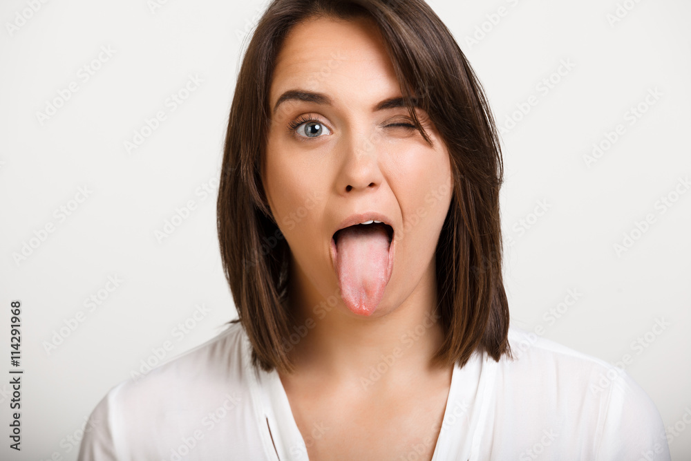 Portrait of girl playing ape over white background. Portrait of girl playing ape over white background.