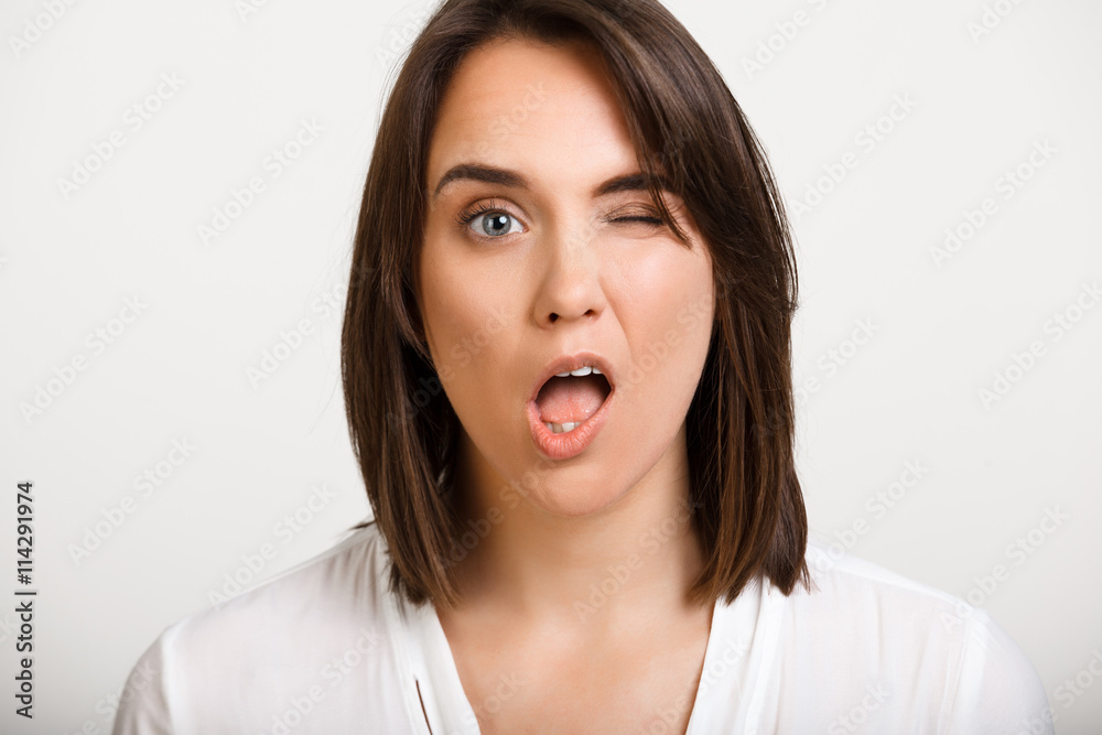 Portrait of girl playing ape over white background. Portrait of girl playing ape over white background.