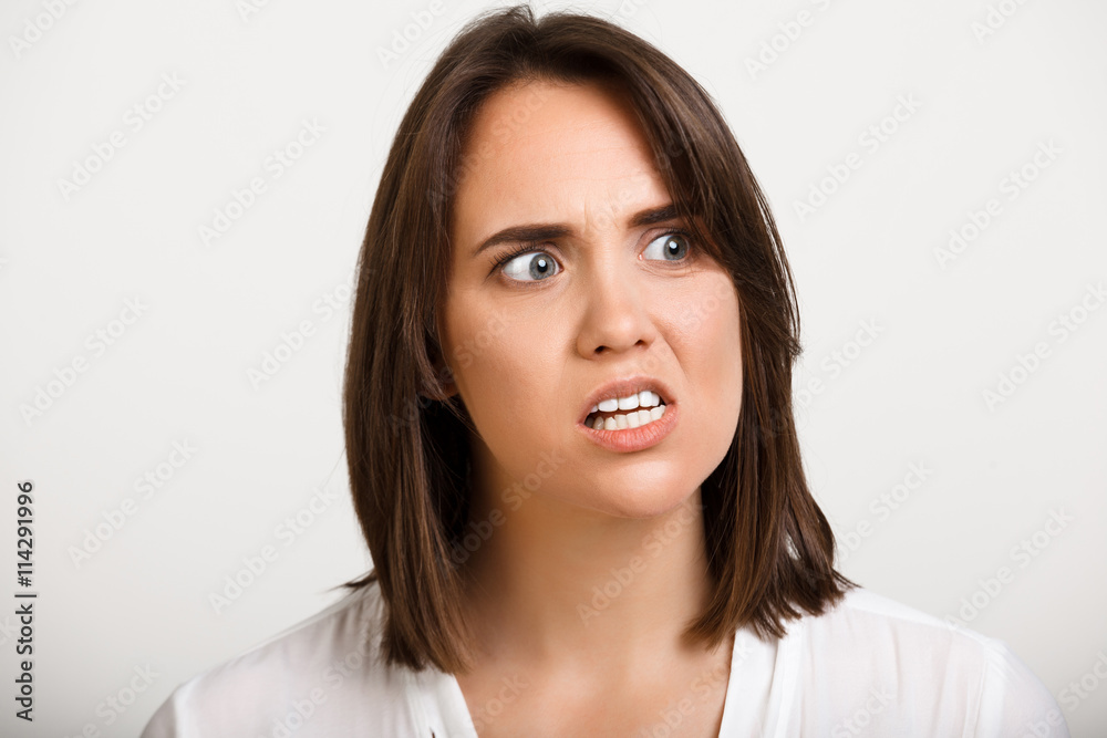 Portrait of girl playing ape over white background. Portrait of girl playing ape over white background.