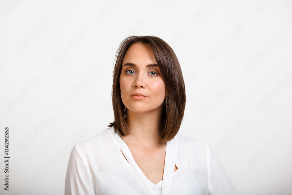 Portrait of young successful business woman over white backgroun Portrait of young successful business woman over white backgroun