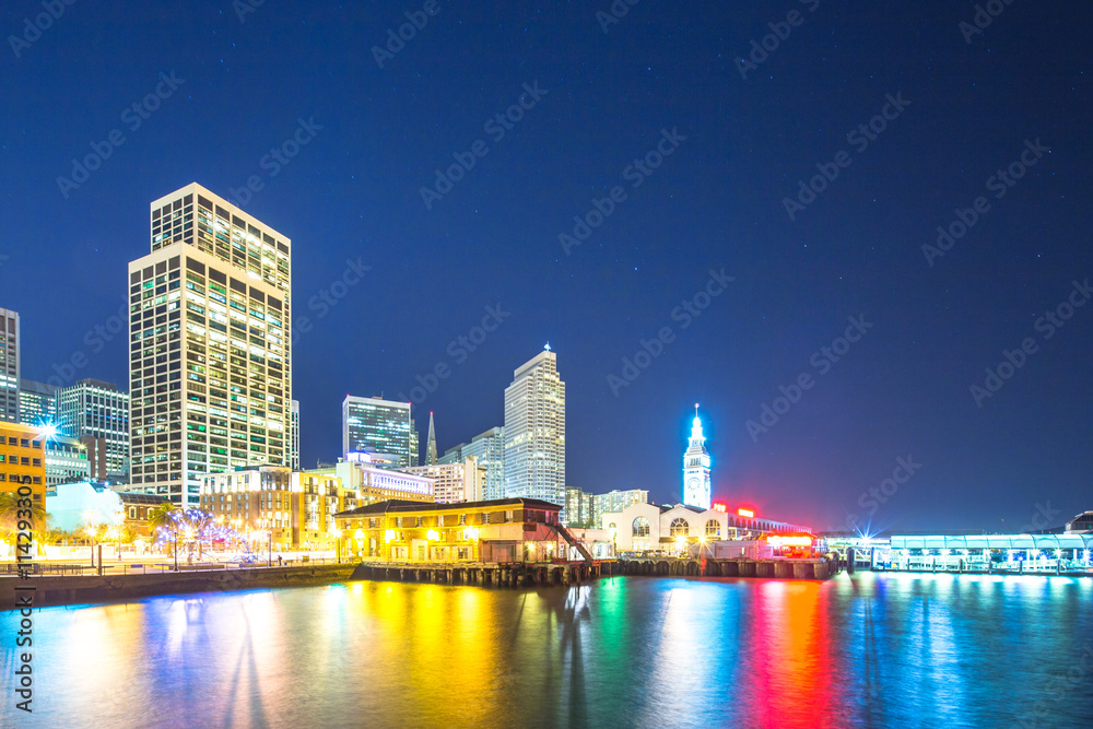 modern office buildings near water at night in san francisco