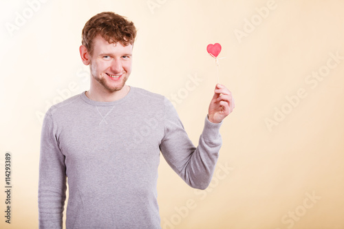 Man holding heart in hand.