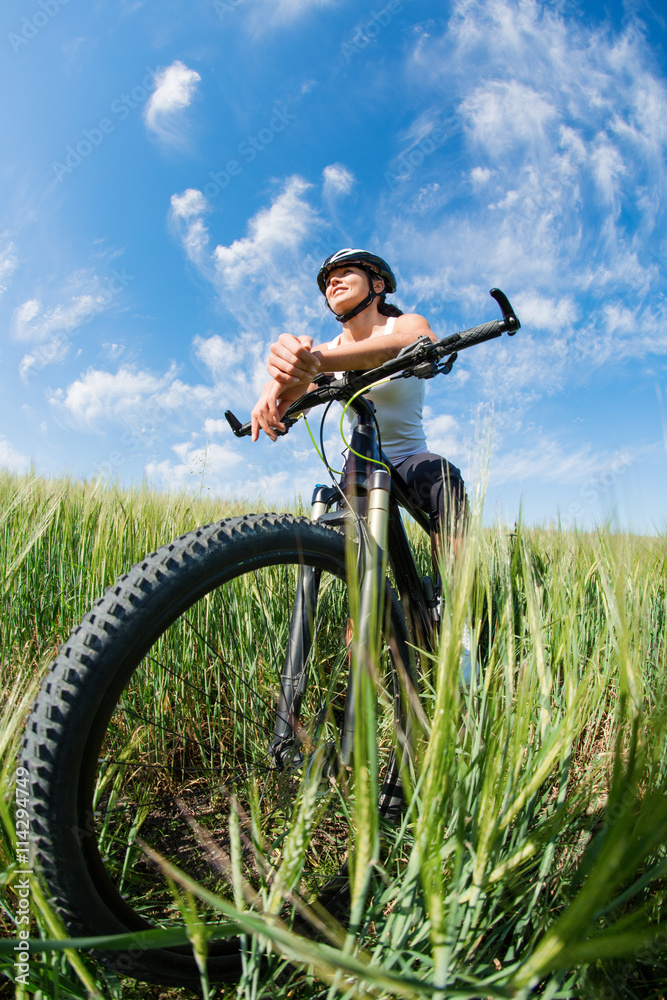 Happy Young Woman riding bicycle outside Happy Young Woman riding bicycle outside