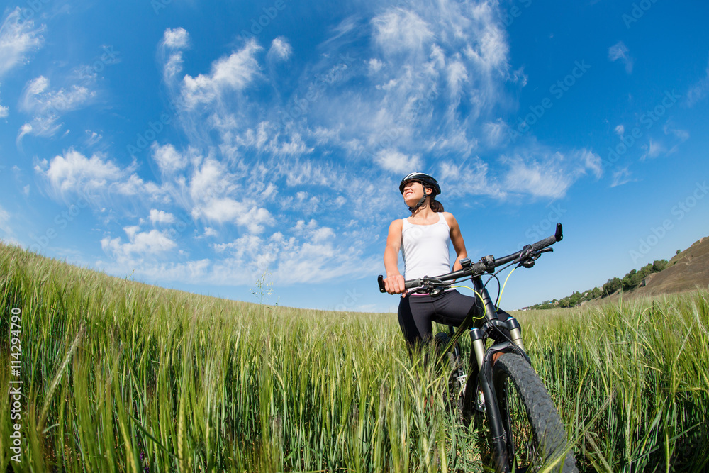 Happy Young Woman riding bicycle outside Happy Young Woman riding bicycle outside