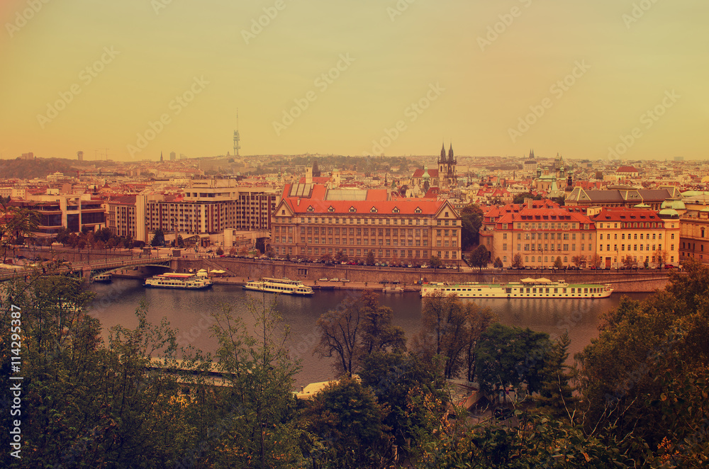 Center of Prague city at autumn with red roofs, european travel landscape background in vintage style