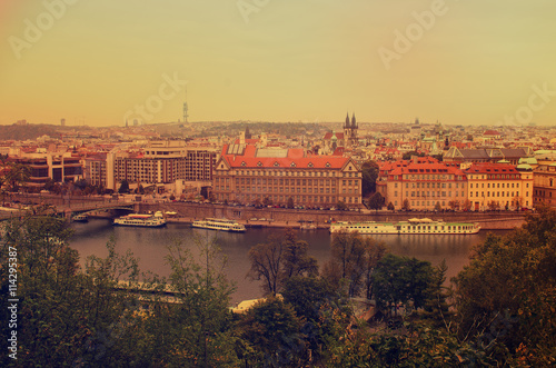 Center of Prague city at autumn with red roofs, european travel landscape background in vintage style