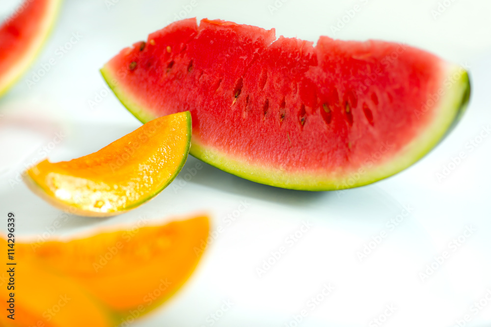Slice of watermelon and melon on white background Slice of watermelon and melon on white background