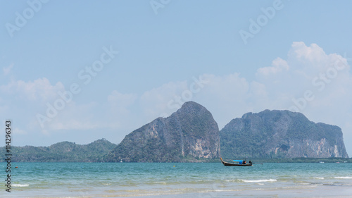 A boat in the beautiful sea and blue sky at Pakmeng beach