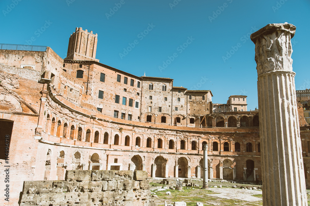 view of diocleziano baths ruins in rome with column an market in daylight