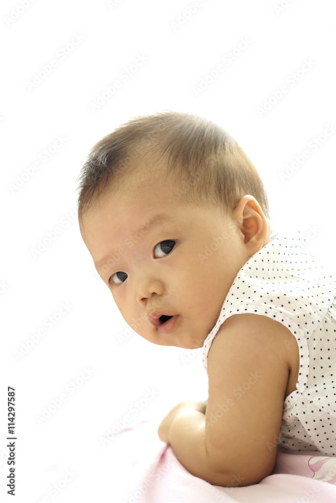 Little Asian infant playing on the floor. Little Asian infant playing on the floor.