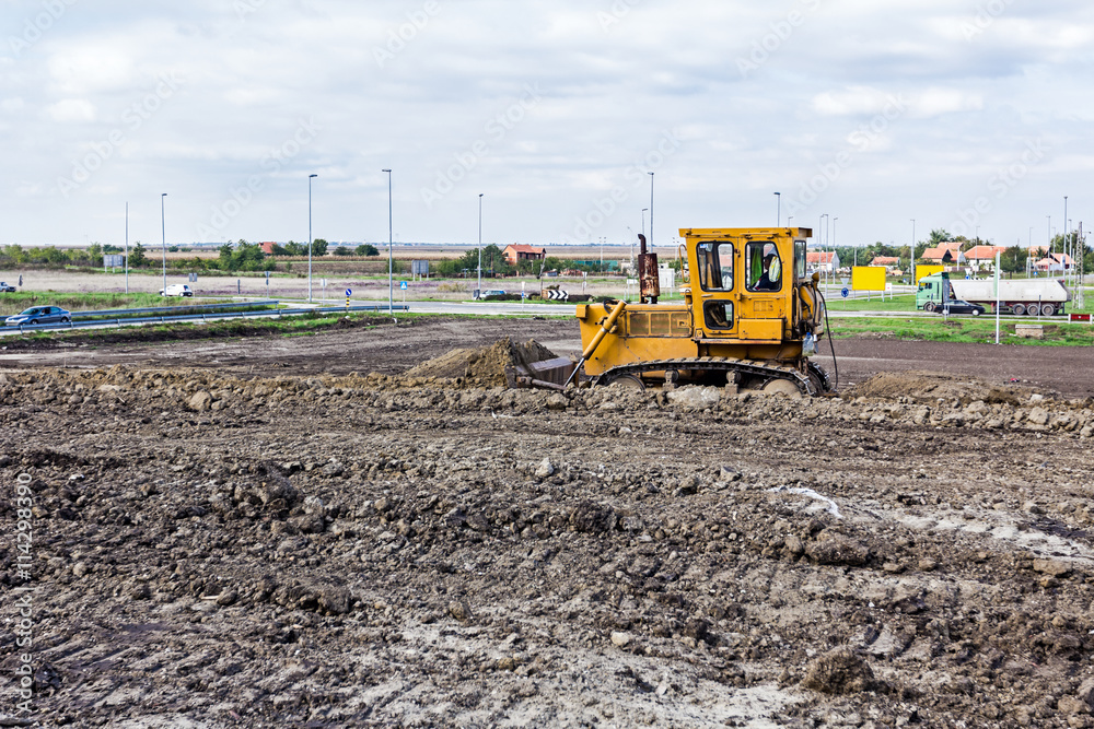 Bulldozer machine is leveling construction site Bulldozer machine is leveling construction site