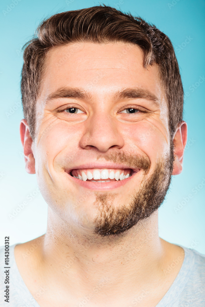 Obraz premium Happy man with half shaved face beard hair.