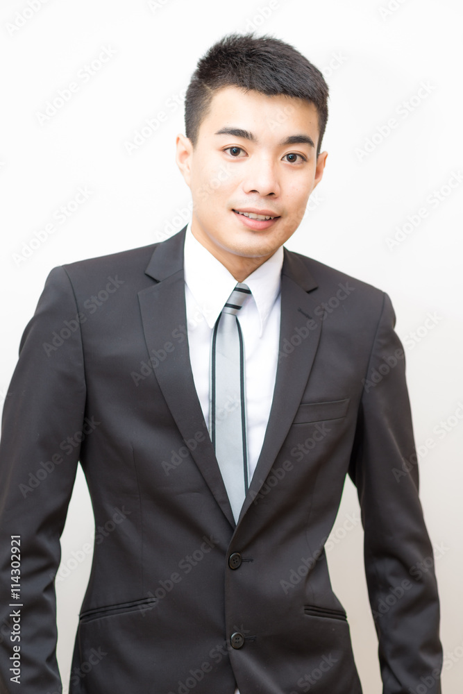 Asian handsome smart young business man on black suit smilling Asian handsome smart young business man on black suit smilling