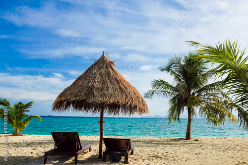 This is the vacation time show wood chairs on a beautiful tropic