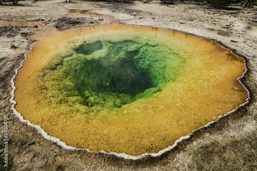Colorful of Morning glory pool Geyser at Old Faithful photo