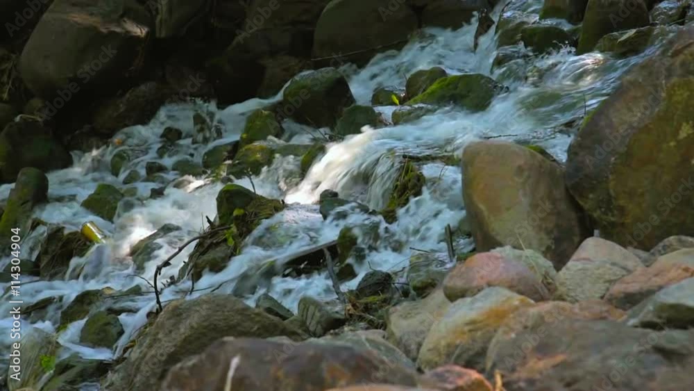 Small river or creek stream with stones Small river or creek stream with stones