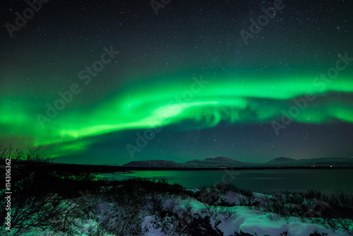 An aurora  sometimes referred to as a polar light  is a natural light display in the sky  predominantly seen in the high latitude  Arctic and Antarctic  regions.