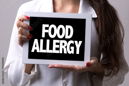 Female doctor holding a tablet with the text: Food Allergy