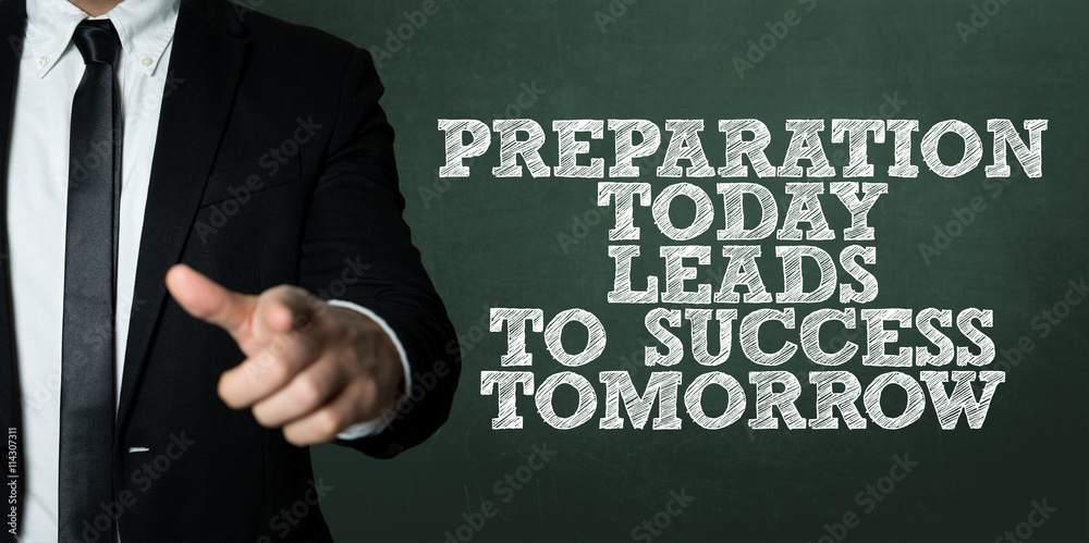 Business man pointing with the text: Preparation Today Leads To Success Tomorrow Business man pointing with the text: Preparation Today Leads To Success Tomorrow