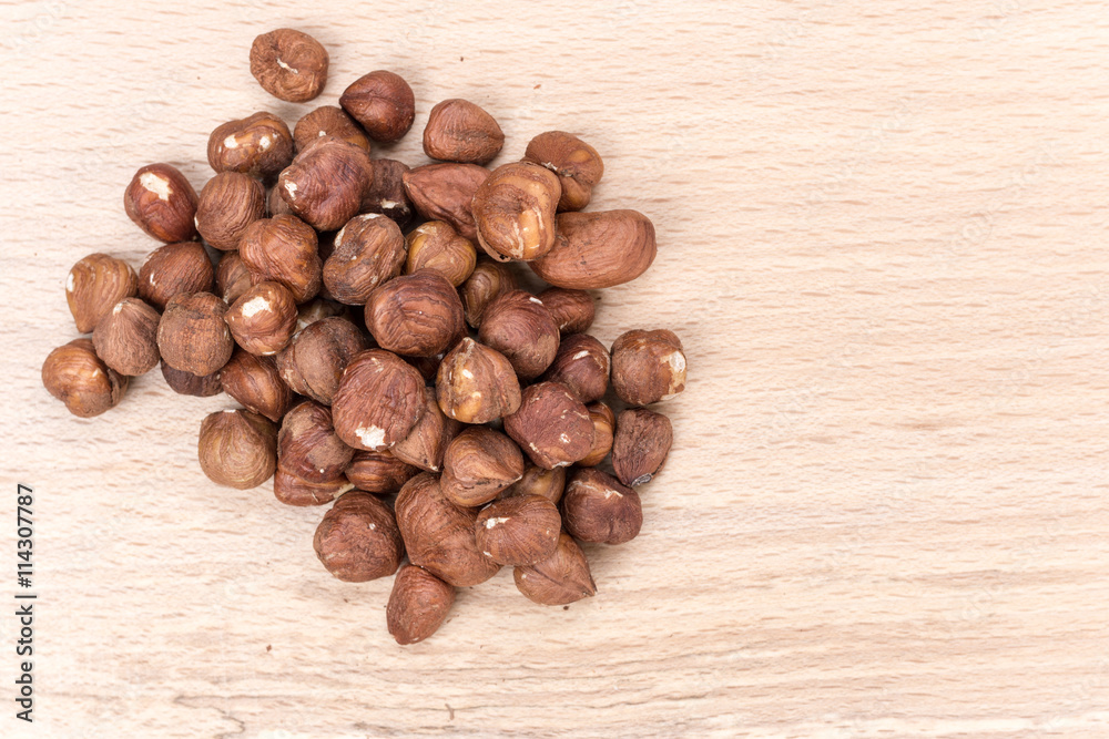 Bunch of hazelnut on the cutting board Bunch of hazelnut on the cutting board