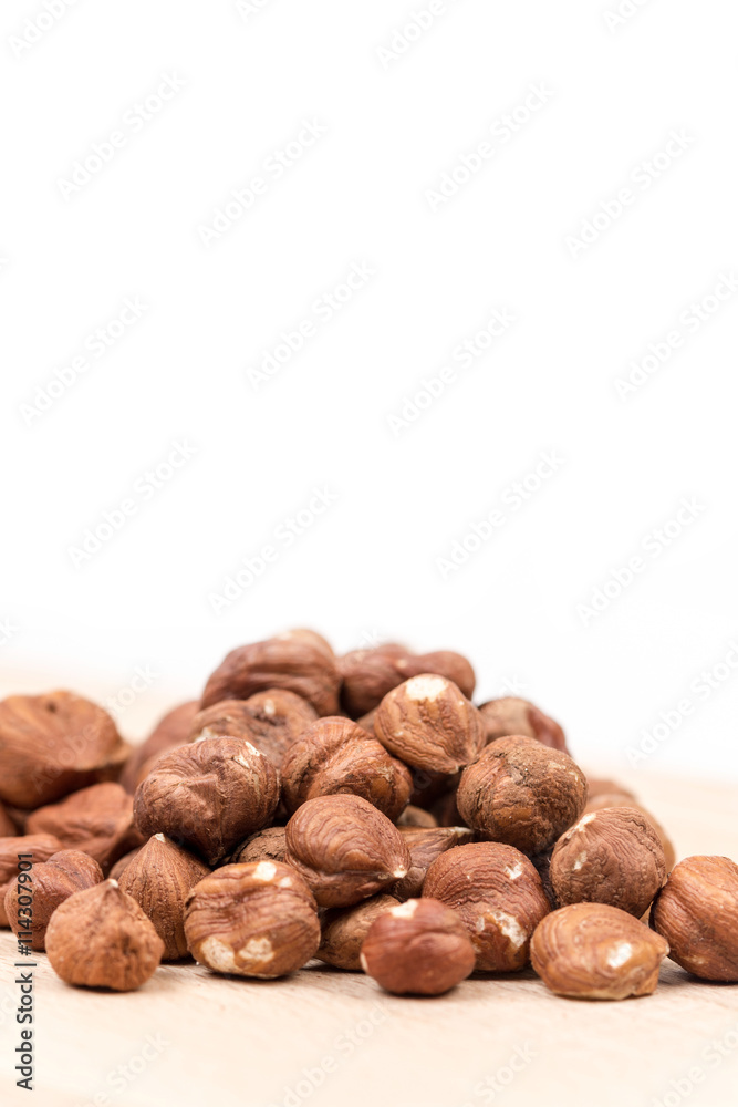 Bunch of hazelnut on the cutting board copy space Bunch of hazelnut on the cutting board copy space
