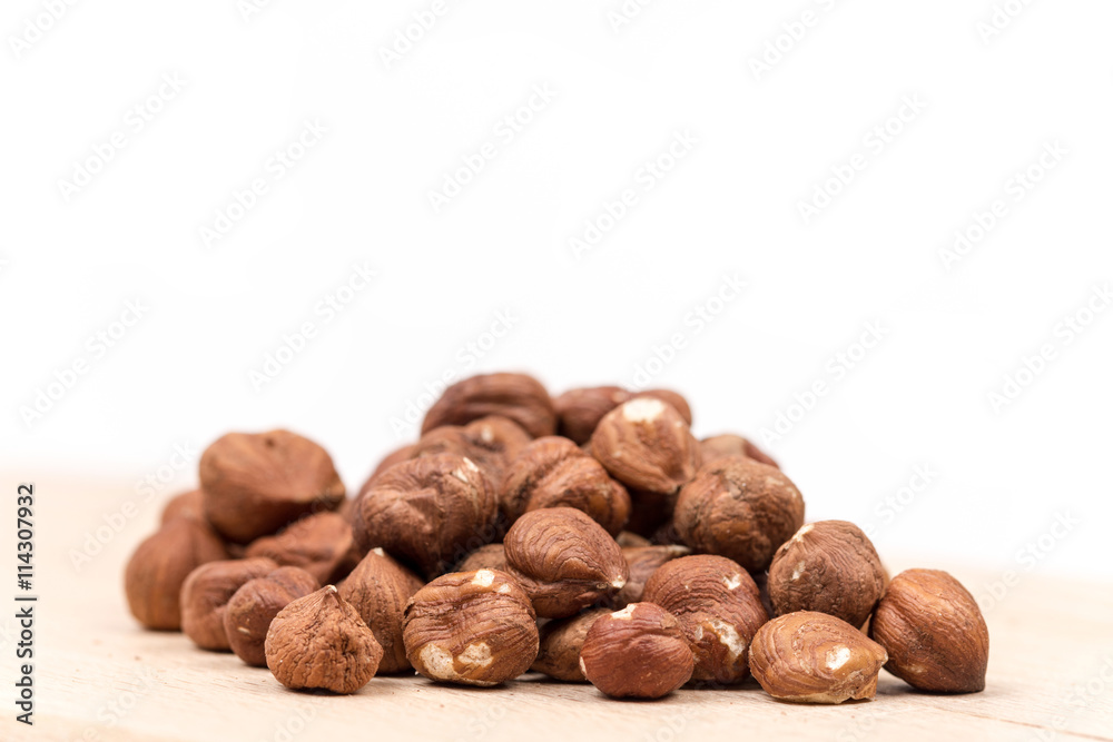 Bunch of hazelnut on the cutting board copy space Bunch of hazelnut on the cutting board copy space