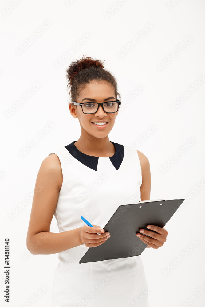 Portrait of young successful african business lady over white ba Portrait of young successful african business lady over white ba