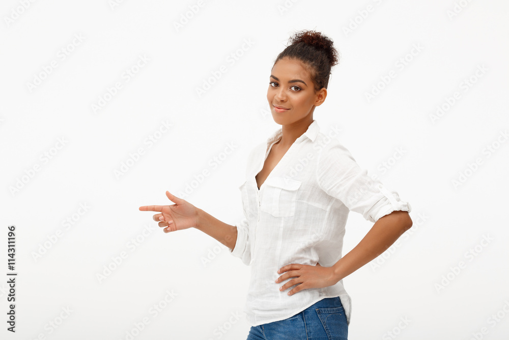 Portrait of young beautiful african girl over white background. Portrait of young beautiful african girl over white background.