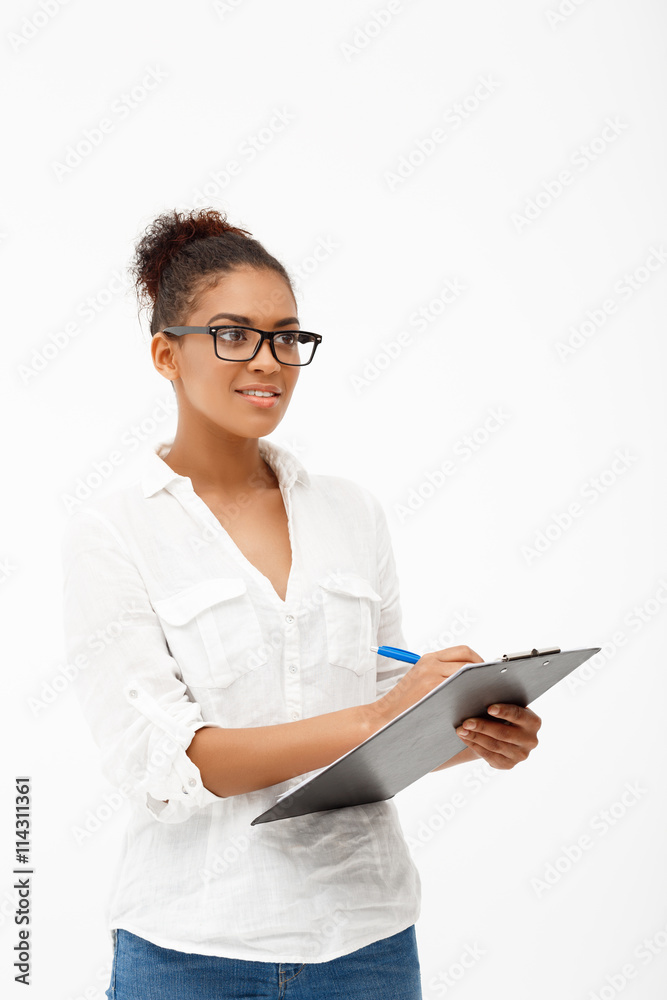 Portrait of young successful african business lady over white ba Portrait of young successful african business lady over white ba