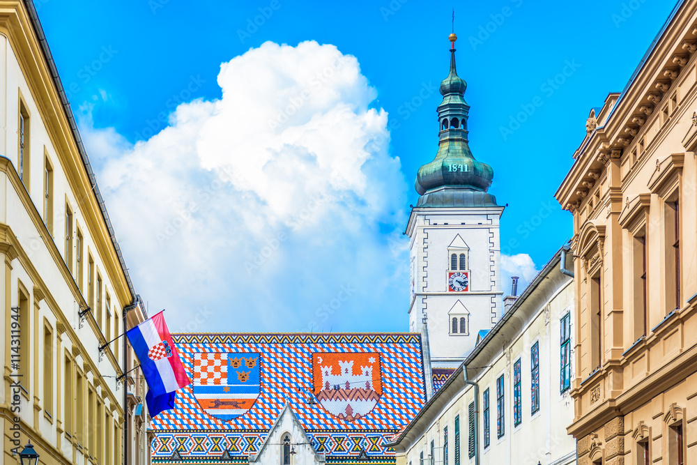 St. Mark's square Zagreb Croatia./ V iew at upper town of Zagreb, main national church roof with croatian emblems  and flag on St. Mark's square in Croatia, Europe. / 