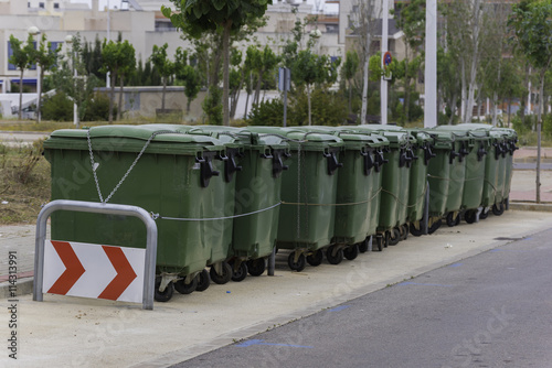 Fila de contenedores de basura. photo