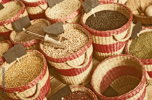 Closeup view on various beans in baskets selling on market