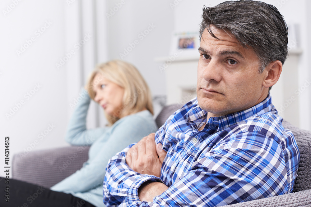 Couple With Relationship Difficulties Sitting On Sofa Couple With Relationship Difficulties Sitting On Sofa