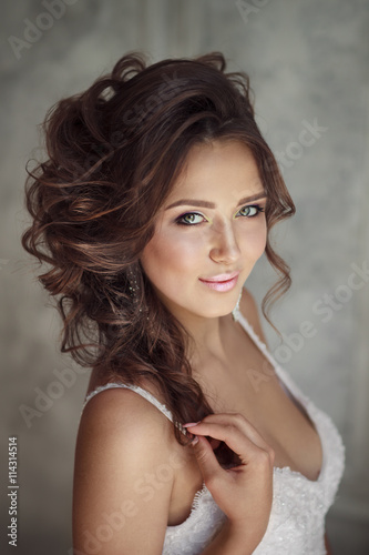 Portrait of beautiful bride with perfect makeup and hairstyle
