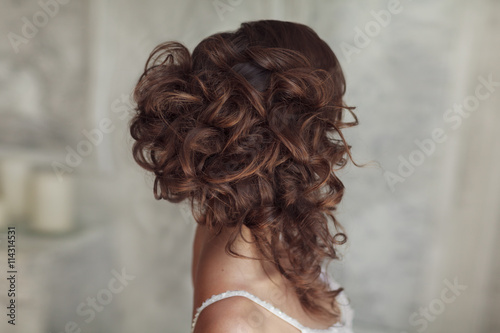 Studio portrait of beautiful bride's hairstyle.