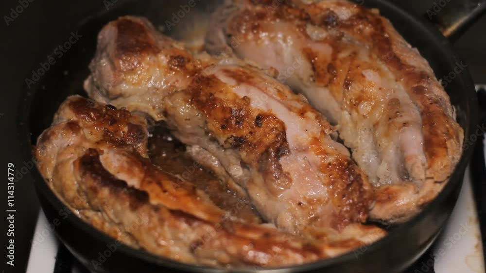 Fry Meat in a Frying Pan In the kitchen, in a frying pan fried large pieces of meat Fry Meat in a Frying Pan In the kitchen, in a frying pan fried large pieces of meat