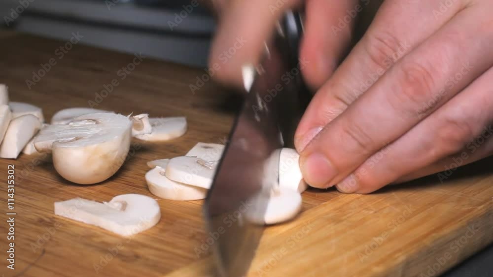 Knife Cut Mushrooms Cooking - cutting mushrooms in the kitchen. Knife Cut Mushrooms Cooking - cutting mushrooms in the kitchen.