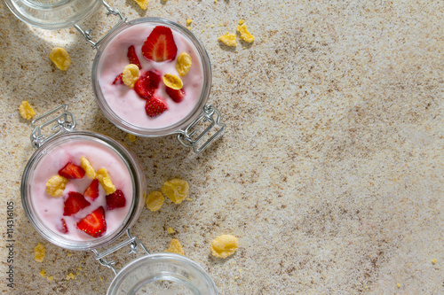 Homemade yogurt with corn flakes and berries, healthy eating yog photo