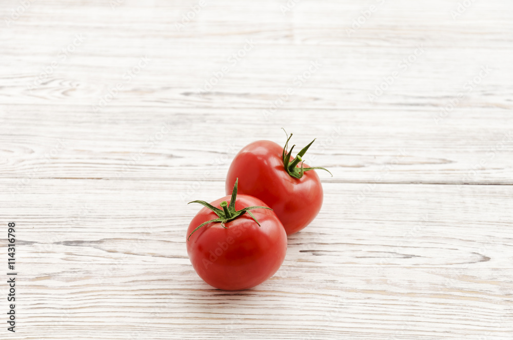 Two red tomatoes. Two red tomatoes.