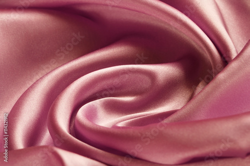 large folds on the pink fabric, abstract background