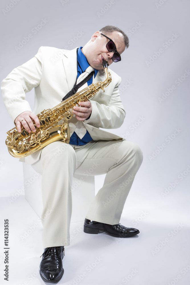 Fototapeta premium Music Concepts. Caucasian Mature Male Musician Playing Alto Saxo