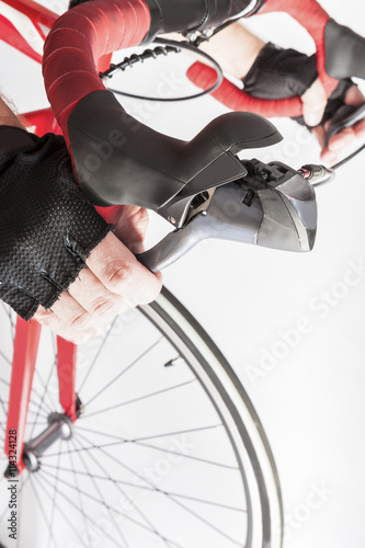 Road Cycling Sport Ideas and Concepts. Closeup of Athlete Hands on Dual Controls Levers