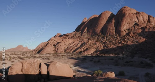 4K panning shot of the granite peaks of the Spitzkoppe mountains photo