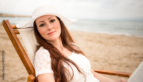 Pretty woman with white hat...