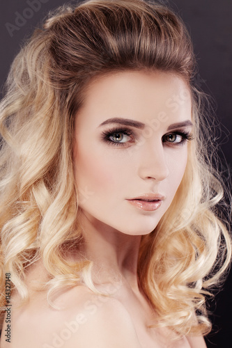 Beautiful Woman with Makeup and Wavy Permed Hair
