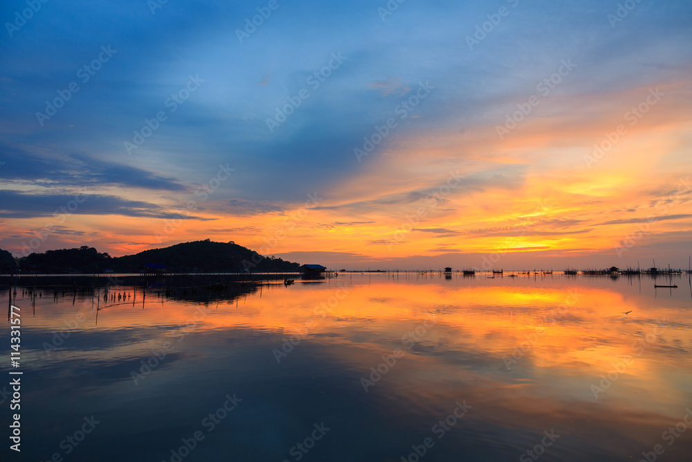 Colorful sky and colorful water in lake reflected in evening time