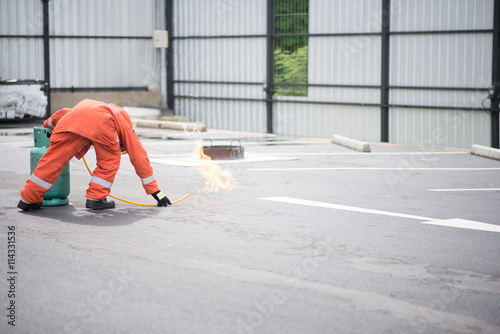 Firefighter fighting fire during training